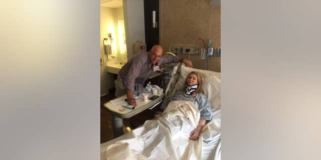 Heather Childers is visited by a friend while recovering after surgery at New York Presbyterian Columbia Medical Center in July