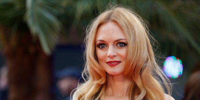 Heather Graham arrives for the European premiere of the film The Hangover Part III at the Empire Cinema in central London May 22, 2013. REUTERS/Luke MacGregor  (BRITAIN - Tags: ENTERTAINMENT) - RTXZWVZ