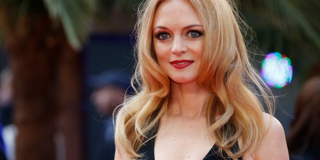 Heather Graham arrives for the European premiere of the film The Hangover Part III at the Empire Cinema in central London May 22, 2013. REUTERS/Luke MacGregor (BRITAIN - Tags: ENTERTAINMENT) - RTXZWVZ