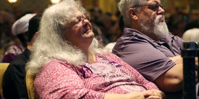 Susan Bro, mother to Heather Heyer, becomes emotional during a memorial for her daughter, Wednesday, Aug. 16, 2017, at the Paramount Theater in Charlottesville, Va. Heyer was killed Saturday, when a car rammed into a crowd of people protesting a white nationalist rally. (Andrew Shurtleff/The Daily Progress via AP, Pool)