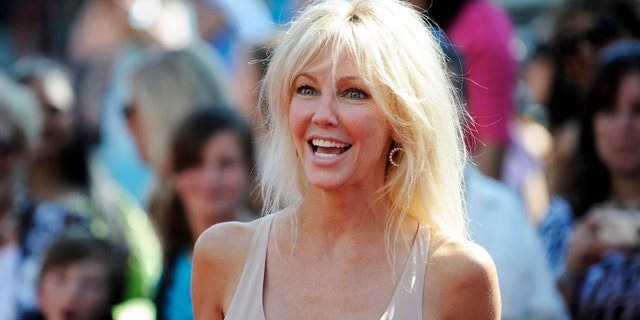 Actress Heather Locklear arrives for the finale of Season 8 of "American Idol" in Los Angeles May 20, 2009.   REUTERS/Phil McCarten  (UNITED STATES ENTERTAINMENT) - RTXKENK