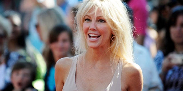 Actress Heather Locklear arrives for the finale of Season 8 of "American Idol" in Los Angeles May 20, 2009. REUTERS/Phil McCarten (UNITED STATES ENTERTAINMENT) - RTXKENK