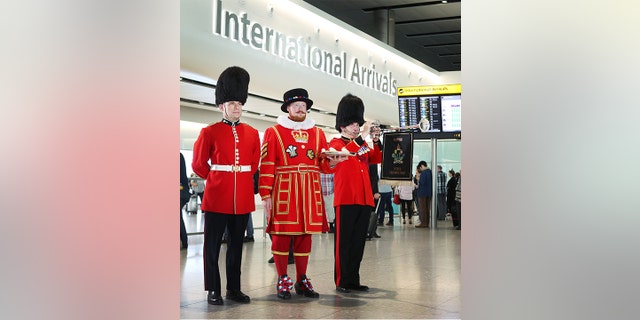 People passing through arrivals will be greeted by the sight of a Queen’s Guard, a Beefeater and the sounds of a royal trumpeter.