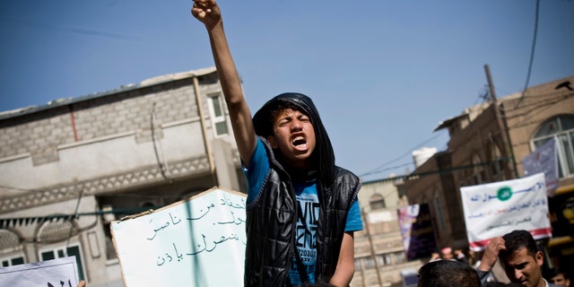 Jan. 17, 2015: A Yemeni youth chants slogans during a protest against caricatures published in French magazine Charlie Hebdo in front of the French Embassy in Sanaa, Yemen.