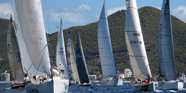 Day 1 of the 33rd Annual St. Maarten/St. Martin Heineken got under way in light winds of 6 to 8 knots for the slow around the Island race. This International event plays host to more than 32 countries and close to 200 entries, making it the largest regatta in the Region! What could be better than racing in the Tropical sun with crystal clear water and ice cold Heinekens?
Photo credit ©Bob Grieser/OUTSIDEIMAGES.COM Outside Images Photo Agency