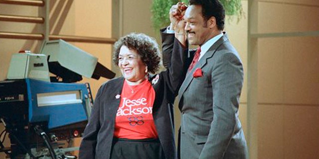 File: Democratic presidential hopeful Jesse Jackson clasps hands with his mother, Helen Jackson, during taping of the Phil Donahue show in New York.