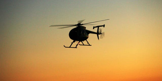JACUMBA, CA - APRIL 8: A Border Patrol helicopter flies along the border after sunset as the Minuteman Civil Defense Corps (MCDC) patrols the U.S.-Mexico border in search of illegal immigrants and drug smugglers April 8, 2006 near Jacumba, California. MCDC is conducting the patrols in all four U.S.-Mexico border states and in several places along the Canadian border throughout the month of April as Congress considers changes to immigration and border security laws. Late last week, a ?breakthrough? compromise Senate leaders announced in the overhaul of immigration law, that could have led to the passage of a bill that would give the nation's estimated 11 million-plus illegal immigrants a chance to obtain U.S. citizenship, fell apart before the start of the two-week Spring recess. (Photo by David McNew/Getty Images)