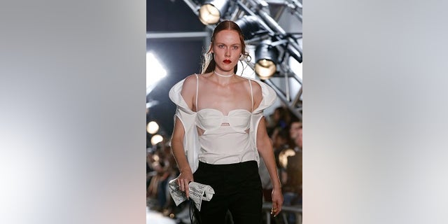 A model walks the runway at the Helmut Lang Seen by Shayne Oliver fashion show during Fashion Week, Monday, Sept. 11, 2017, in New York. (AP Photo/Kathy Willens)