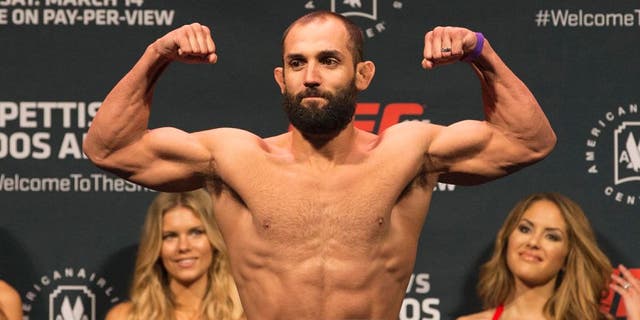 Mar 13, 2015; Dallas, TX, USA; Johny Hendricks stands on the scale during weigh-ins for UFC 185 at Kay Bailey Hutchison Convention Center. Mandatory Credit: Tim Heitman-USA TODAY Sports