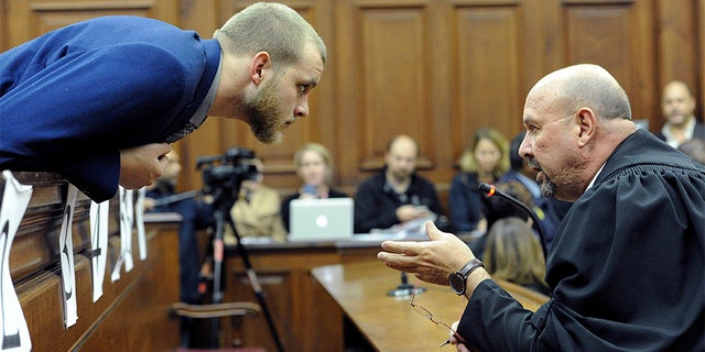 May 21, 2018: Henri van Breda, left, talks to one of his legal adviser, Piet Botha, right, in the High Court.