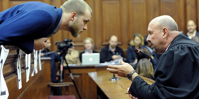 May 21, 2018: Henri van Breda, left, talks to one of his legal adviser, Piet Botha, right, in the High Court.