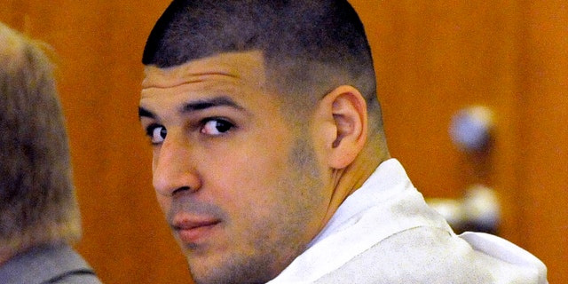 Aaron Hernandez appears at Fall River Superior Court Tuesday, Sept. 30, 2014 in Fall River, Mass. Hernandezâs attorneys are arguing a motion to suppress evidence in his murder trial. They want to suppress evidence from a cell phone they say was illegally seized and a police interrogation they call unlawful. Hernandez is awaiting trial in the 2013 killing of semi-professional football player Odin Lloyd. (AP Photo/The Boston Herald, Ted Fitzgerald, Pool)