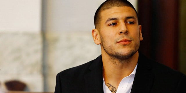 NORTH ATTLEBORO, MA - AUGUST 22: Aaron Hernandez sits in the courtroom of the Attleboro District Court during his hearing on August 22, 2013 in North Attleboro, Massachusetts.
