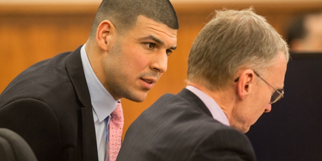 March 2: Former New England Patriots tight end Aaron Hernandez, left, speaks with his attorney Charles Rankin during his murder trial at Bristol County Superior Court in Fall River, Mass.
