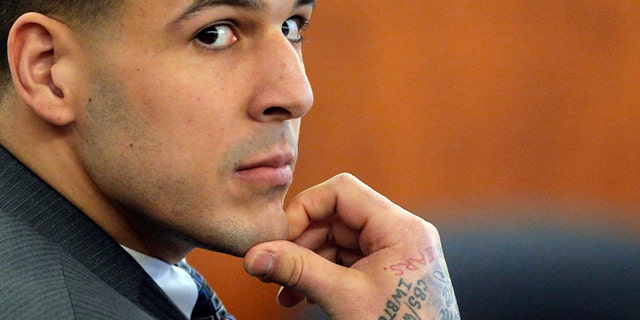 FILE - In this April 1, 2015 file photo, former New England Patriots NFL football player Aaron Hernandez listens as prosecution witness Alexander Bradley testifies during his murder trial, at Bristol County Superior Court in Fall River, Mass. Hernandez is accused of killing Odin Lloyd in June 2013. (AP Photo/Brian Snyder, Pool, File)