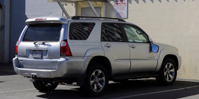In this March 3, 2017, file, photo, the Toyota 4Runner held in a Boston Police evidence lot in the Hyde Park neighborhood of Boston is seen during a "view" of pertinent locations and evidence in the Aaron Hernandez trial.