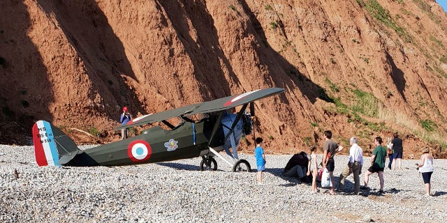 In footage of the plane’s safe landing, one onlooker can be heard yelling, “That’s well done!”