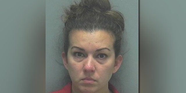 Christina Hester, 39, was seen chopping up a white powdery substance on her phone screen with a credit card while her car was parked in front of a school, authorities say.
