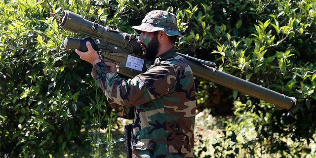 April 20, 2017: A Hezbollah fighter holding an Iranian-made anti-aircraft missile on the border with Israel, in Naqoura, south Lebanon.