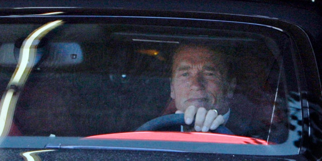 Former California Governor Arnold Schwarzenegger leaves his office Tuesday May 17, 2011 in Santa Monica, Calif.