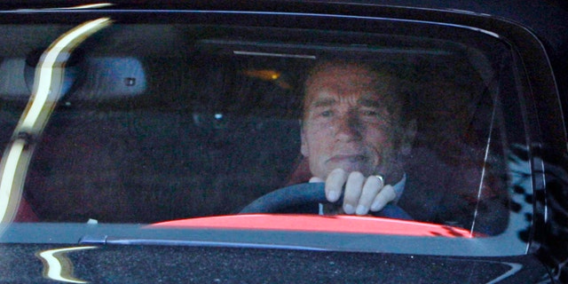 Former California Governor Arnold Schwarzenegger leaves his office Tuesday May 17, 2011 in Santa Monica, Calif.