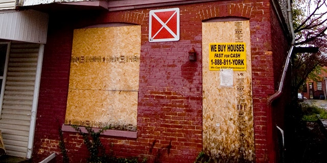 Nov. 4, 2010: In this file photo, a home is shown where young siblings were purportedly living in squalor and secrecy in York City, Pa. According to court records there are five siblings, ranging in age from about 2 to 13 years old, all the children of Sinhue A. Johnson and Louann E. Bowers. The children are now in foster care, and their parents are in York County Prison, charged with child endangerment. (AP/York Dispatch)