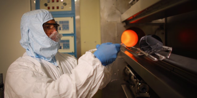 TAMPA, FL - JULY 13: Richard Everly, a research engineer in the nanotechnology research and education center at the University of South Florida, handles silicon wafers in a diffusion furnace on July 13, 2012 in Tampa, Florida. Tampa has opportunities for employers and employees in such high tech industry as agritechnology, aerospace, digital media, energy technologies, life sciences and medical technologies. The city will host the 2012 Republican National Convention at the Tampa Bay Times Forum August 27-30 where the party is expected to officially nominate former Massachusetts Gov. Mitt Romney as their nominee to face President Barack Obama in November in the general election. The convention will host 2,286 delegates and 2,125 alternate delegates from all 50 states, the District of Columbia and five territories as well as scores of journalists, guests and protesters. (Photo by Joe Raedle/Getty Images)