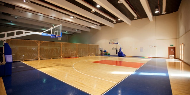 An indoor basketball court stands empty inside the compound of the U.S. embassy in Baghdad December 14, 2011. The compound, located in Baghdad's Green Zone, will be the home for thousands of American citizens left after the U.S. military completes its withdrawal this month. REUTERS/Lucas Jackson (IRAQ - Tags: POLITICS CONFLICT MILITARY SOCIETY) - RTR2V843