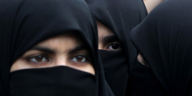 Supporters of Pakistani religious party Jamaat-e-Islami hold a rally to observe the World Hijab (veil) Day in Islamabad, Pakistan, Wednesday, Sept. 4, 2013. Scores of the party's female supporters wearing veils gathered to advocate the necessity of veil for the Muslim women. (AP Photo/B.K. Bangash)