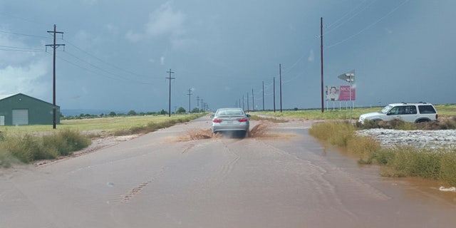 Sept. 14, 2015: This photo shows flooding on U.S. Highway 89 in Hildale, Utah. State officials said seven people were killed and six others missing when two cars were washed away by a flash flood Monday. (Courtesy Tabitha Corry)