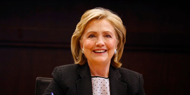 Former U.S. Secretary of State Hillary Clinton signs copies of her book "Hard Choices" at a Barnes &amp; Noble book store in Los Angeles, California June 19, 2014.  REUTERS/Lucy Nicholson    (UNITED STATES - Tags: POLITICS MEDIA) - RTR3UQNK