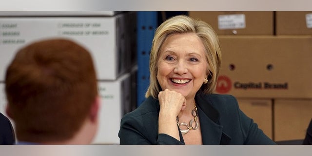 April 15, 2015: Presidential candidate and former Secretary of State Hillary Clinton listens to small business owners as she campaigns for the 2016 Democratic presidential nomination at Capital City Fruit in Norfolk, Iowa.