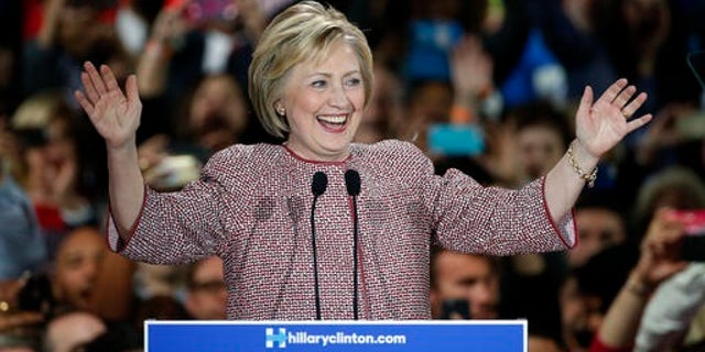 Democratic presidential candidate Hillary Clinton celebrates on stage after winning the New York state primary Tuesday, April 19, 2016, in New York. (AP Photo/Kathy Willens)