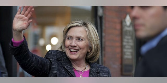 Democratic presidential candidate Hillary Clinton waves to supporters gathered outside after she spoke at the Water Street Bookstore in Exeter, New Hampshire May 22, 2015. REUTERS/Brian Snyder - RTX1E6EM