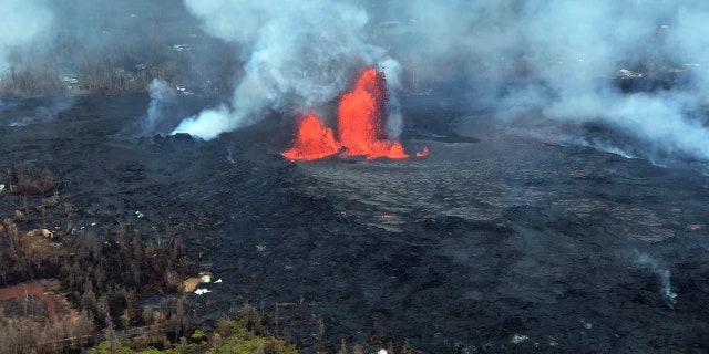 In this Saturday, May 26, 2018, image released by the U.S. Geological Survey HVO shows an aerial view of fissure 22 looking toward the south, as Kilauea Volcano continues its eruption cycle near Pahoa on the island of Kilauea, Hawaii.