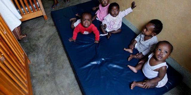 Abandoned children play at the Don Bosco Ngangi community center in the Democratic Republic of the Congo. The center was established in 1988 and hosts over 3,000 abandoned children and HIV/AIDS victims.(REUTERS/Thomas Mukoya)