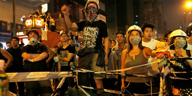Oct. 5, 2014: Pro-democracy protesters stage a rally on a occupied road in Mong Kok district, Hong Kong. (AP)