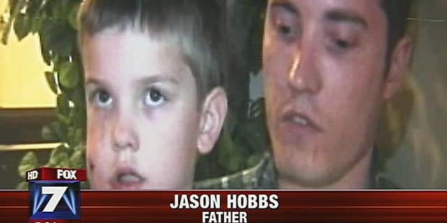 Rivers Hobbs with his father, Jason Hobbs, who stabbed the mountain lion with a pocketknife, causing it to flee.
