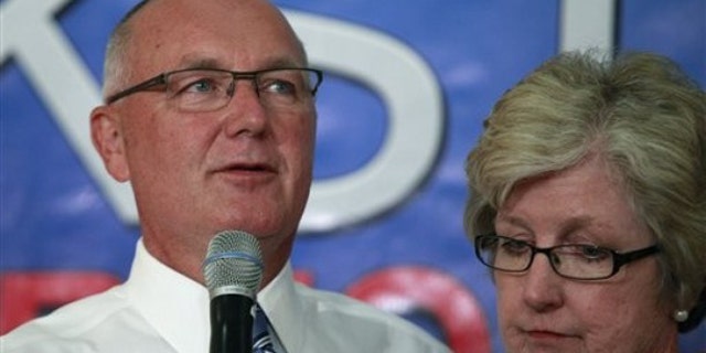 In this Aug. 3, 2010, photo, then-Rep. Pete Hoekstra stands with his wife, Diane, as he concedes during an election gathering for the Michigan gubernatorial primary in Hudsonville, Mich.