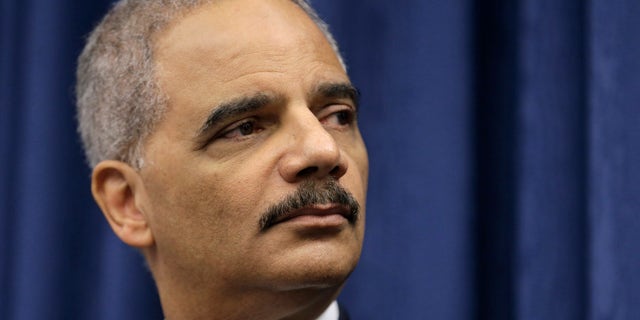 Dec. 4, 2014: U. S. Attorney General Eric Holder speaks during a news conference before a roundtable meeting in Cleveland.