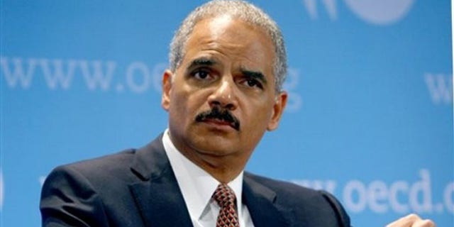 Attorney General Eric Holder is seen at the Organization for Economic Co-operation and Development during a meeting May 31 in Paris. (AP Photo)