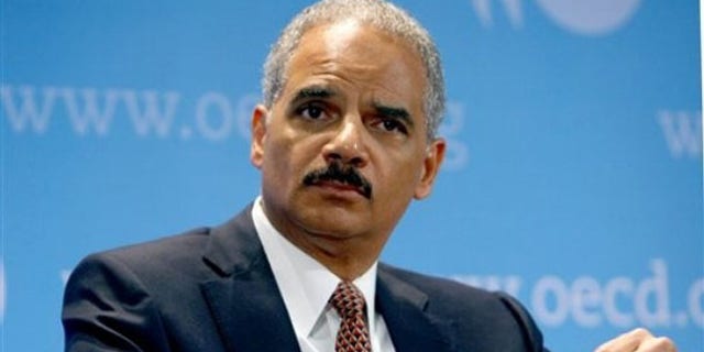 Attorney General Eric Holder is seen at the Organization for Economic Co-operation and Development during a meeting May 31 in Paris. (AP Photo)