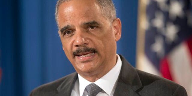 Attorney General Eric Holder announces at the Justice Department in Washington Monday, July 14, 2014, that Citigroup will pay $7 billion to settle an investigation into risky subprime mortgages. (AP Photo/Pablo Martinez Monsivais)
