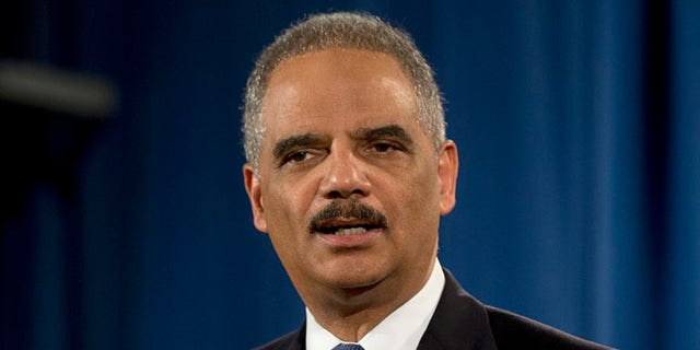 In this March 4, 2015, file photo, then-Attorney General Eric Holder speaks at the Justice Department in Washington.