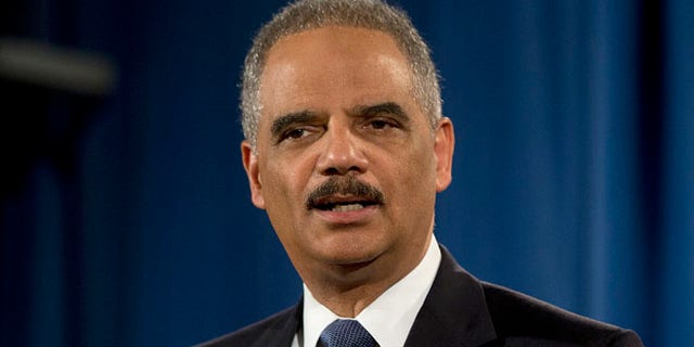 In this March 4, 2015, file photo, then-Attorney General Eric Holder speaks at the Justice Department in Washington.