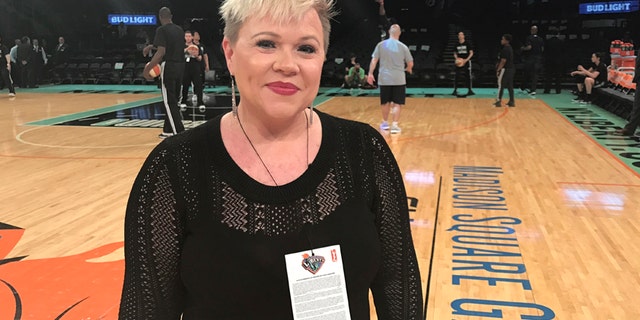 Holly Rowe stands on the court at Madison Square Garden in New York before a WNBA basketball game between the New York Liberty and the Minnesota Lynx, Thursday, May 18, 2017.