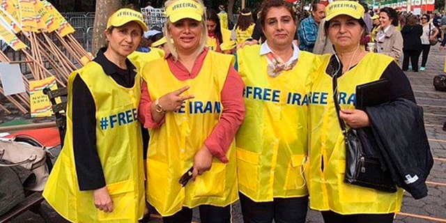 Protestors affiliated with the National Council of Resistance to Iran push for an overthrow of the Rouhani-led regime outside the United Nations on Wednesday.