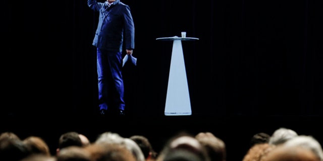 The hologram of hard-left French presidential candidate Jean-Luc Melenchon speaks to supporters who are gathered in Saint-Denis, near Paris.