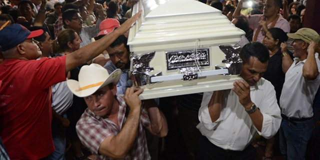 Relatives and friends carry the coffin of murdered indigenous activist Berta Caceres during her funeral in La Esperanza, 200 km northwest of Tegucigalpa, on March 3, 2016. Caceres, a respected environmentalist who won the prestigious Goldman Prize last year for her outspoken advocacy, was murdered in her home Thursday, her family said. AFP PHOTO /ORLANDO SIERRA / AFP / ORLANDO SIERRA        (Photo credit should read ORLANDO SIERRA/AFP/Getty Images)
