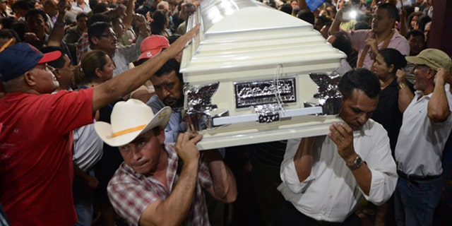 Relatives and friends carry the coffin of murdered indigenous activist Berta Caceres during her funeral in La Esperanza, 200 km northwest of Tegucigalpa, on March 3, 2016. Caceres, a respected environmentalist who won the prestigious Goldman Prize last year for her outspoken advocacy, was murdered in her home Thursday, her family said. AFP PHOTO /ORLANDO SIERRA / AFP / ORLANDO SIERRA (Photo credit should read ORLANDO SIERRA/AFP/Getty Images)